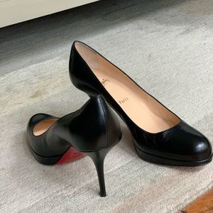 Christian Louboutin round toe pumps